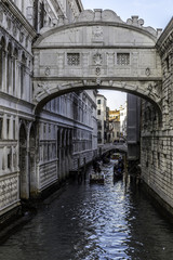 Bridge of Sighs at Doge's Palace with gondolas, Venice, Italy