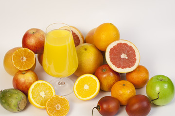Fototapeta na wymiar Exotic fruits and juice on a white background