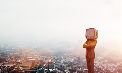 Businessman with old TV instead of head.
