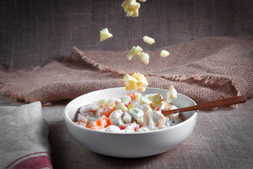 fruit salad of oranges, grapefruit, bananas, kiwi dressed with natural yoghurt and sprinkled with chopped Apple