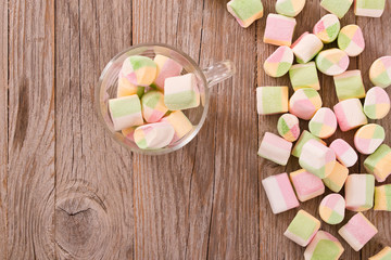 Marshmallows on wooden table. 