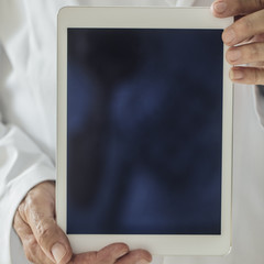 Physician Holding Tablet