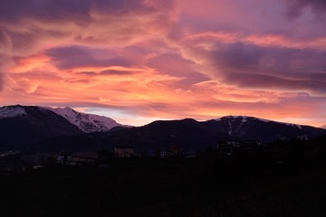 Pink clouds above the mountains