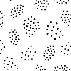 Abstract geometric seamless pattern with randomly scattered round dots.  Drawn by hand. Black circles on white background.