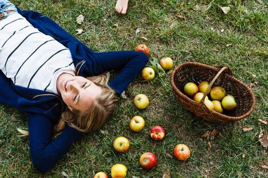 Woman with basket of apples