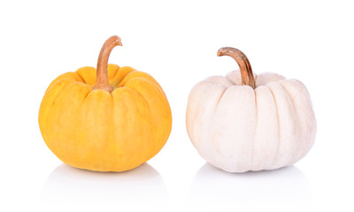 Little decorative orange and white pumpkin on white background