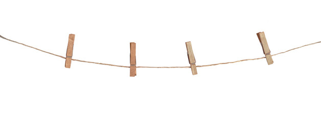 Four wooden clothespins on a rope, isolated on white background