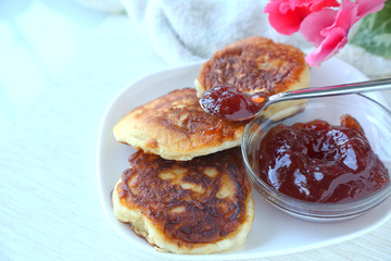Tasty Homemade Pancakes on the white plate with  jam