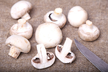 Fototapeta na wymiar Champignon mushrooms and a knife