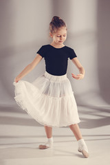 The little balerina dancer on gray background © master1305