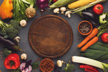Frame of fresh vegetables on wooden background with copy space