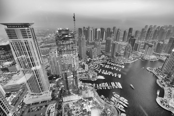 DUBAI - DECEMBER 5, 2016: Aerial view of Dubai Marina skyline at sunset. The city attracts 30...