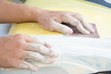 hand close up sanding in the work shop