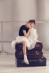 The little girl as balerina dancer sitting at studio © master1305