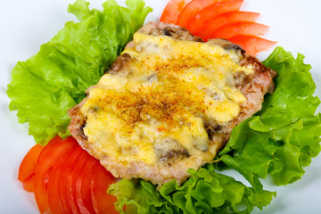 Pork steak with mushroom and cheese