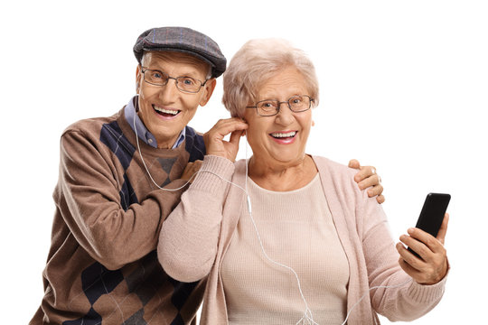 Senior couple listening to music on a phone