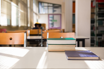 textbooks on table in library