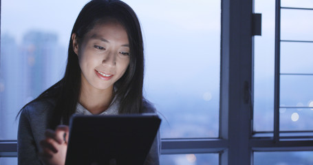 Young Woman use of tablet computer at home