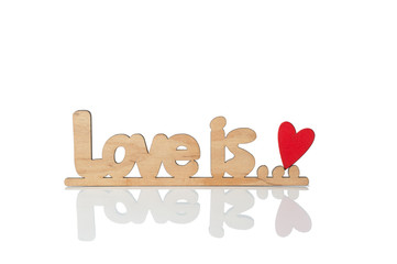 wooden inscription, love is. Isolated on white background