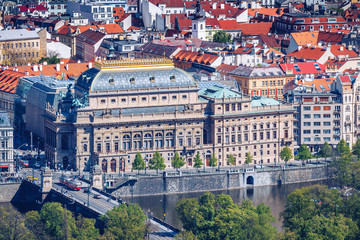 Fototapeta premium View of the Prague National Theater on a bright sunny day along the Vltava River, Czech Republic