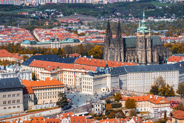 Fototapeta na wymiar Skyline aerial view of Prague old town, Charles bridge, Prague Castle and St Vitus Cathedral and red roofs. Prague, Czech republic.
