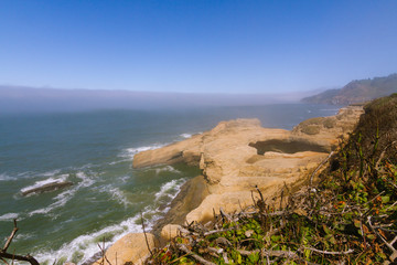 Beach and coastline covered in fog in Oregon, USA