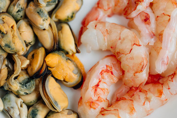 Mussels and prawns on white plate. Healthy Seafood