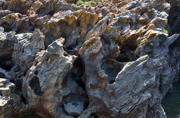 The eroded schists form sharp blades and deep drops in the rocks. Pulo do Lobo. Alentejo, Portugal.