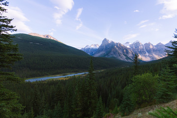 Scenic valley with river in Rocky Mountains in Canada during sunset