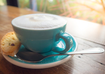 glass of cappuccino coffee on wooden