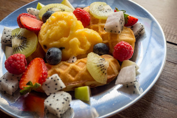 fresh healthy fruit salad on wooden background