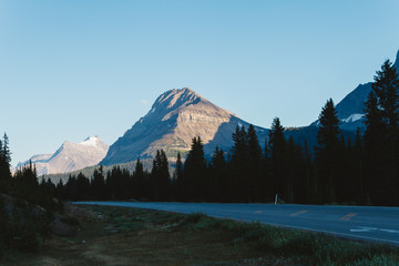 Fototapeta na wymiar Empty road on Icefields Parkway in Rocky Mountains during sunset