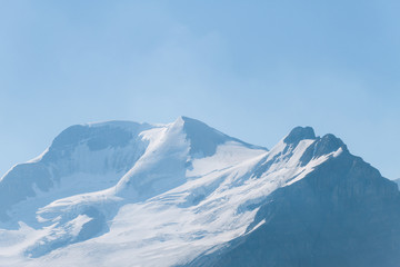 Fototapeta na wymiar Mountains with glacier in Rocky Mountains, Alberta on sunny day