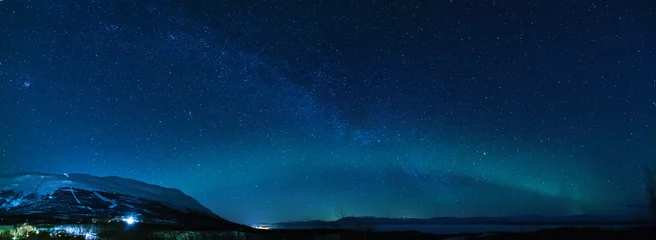 Fotobehang Winter panorama with Milky way and Northen lights in Keruna. © Modella