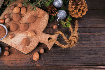 Homemade chocolate truffles, nuts, almonds and cocoa powder