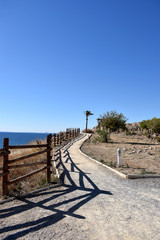 Fototapeta na wymiar Walking path along spanish sea coastline