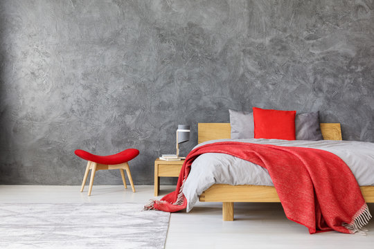 Grey bedroom with red accents