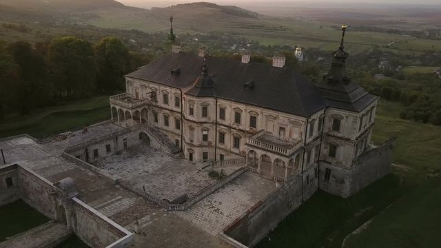 Ukrainian Castle in Pidhirtsi aerial footage at sunset (4k, 25fps)
