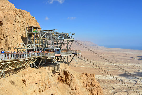Cable car to ruins of Masada. Masada is an ancient fortification in the Southern District of Israel situated on top of an isolated rock plateau, akin to a mesa. 