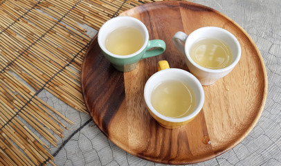 Little yellow cup of white tea