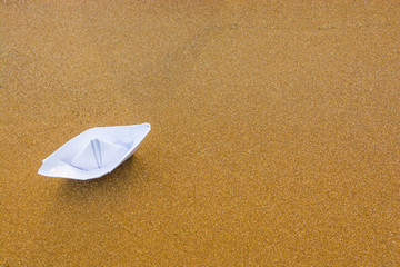 Paper boat on the beach 7