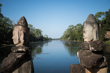 temple statues in front of a river to protect the temple 