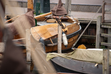 Fototapeta na wymiar Traditional Dutch Botter Fishing Boats in the small Harbor of a Historic Fishing Village