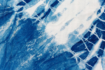 The fabric indigo tie dye as a background and texture.