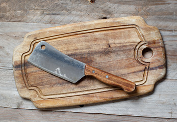 Old hatchet an a cutting board