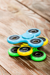 Group of spinners on wooden table