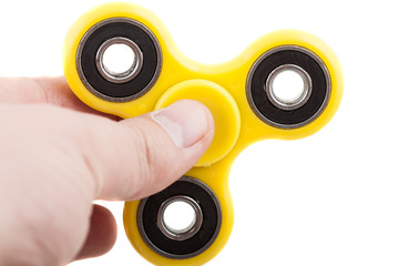 Hand holding popular fidget spinner
