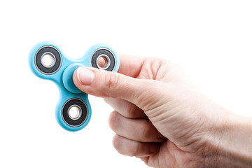 Hand holding popular fidget spinner