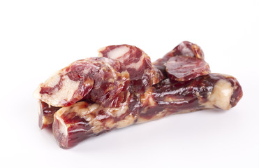 Raw sausages and slices on a white background.