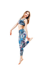 young beautiful woman in color-blue top and leggings jumping of joy. Young sporty fit emale model isolated on white background in full body.